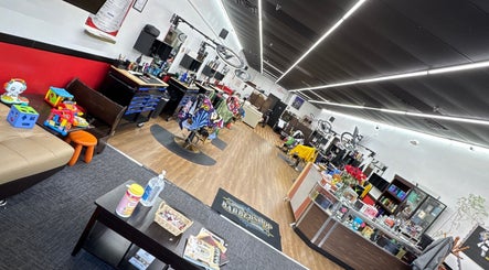 Interior of Ray’s Dominican Barbershop in Roswell, Georgia, US, showcasing a lively and modern space.