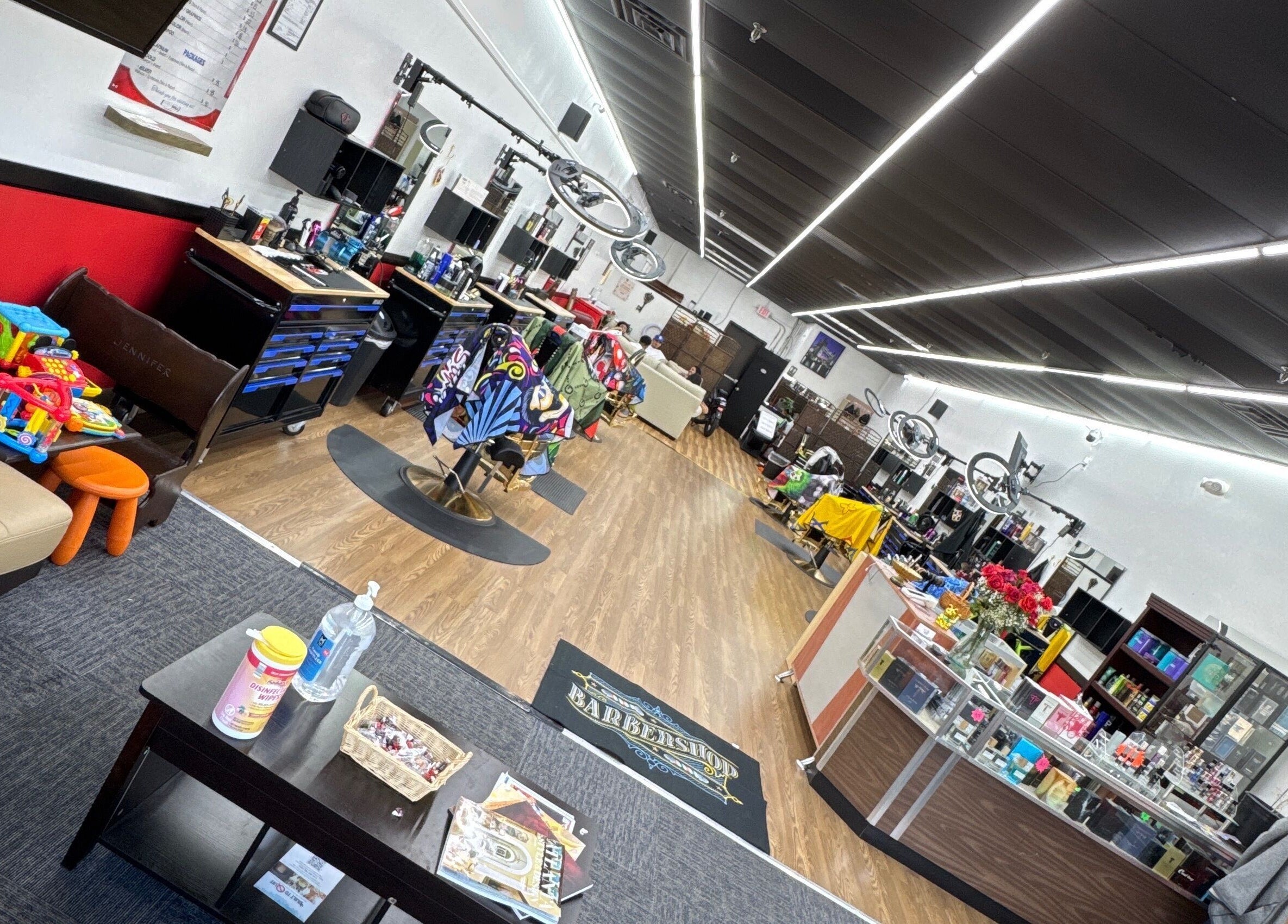 Spacious modern interior of Ray’s Dominican Barbershop in Roswell, Georgia, US with stylish decor and salon chairs.