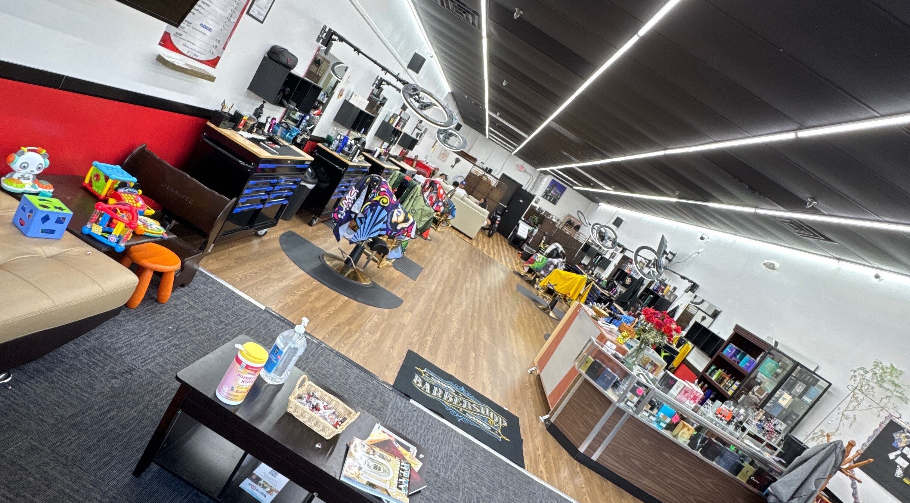 Spacious modern interior of Ray’s Dominican Barbershop in Roswell, Georgia, US with stylish decor and salon chairs.