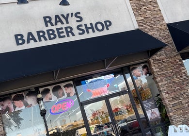 Entrance of Ray’s Dominican Barbershop in Roswell, Georgia, US with a modern design and welcoming vibe.