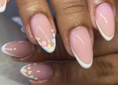 Glossy pastel nail art at Palangana Spa, Willemstad, CW offering unique French tip designs.