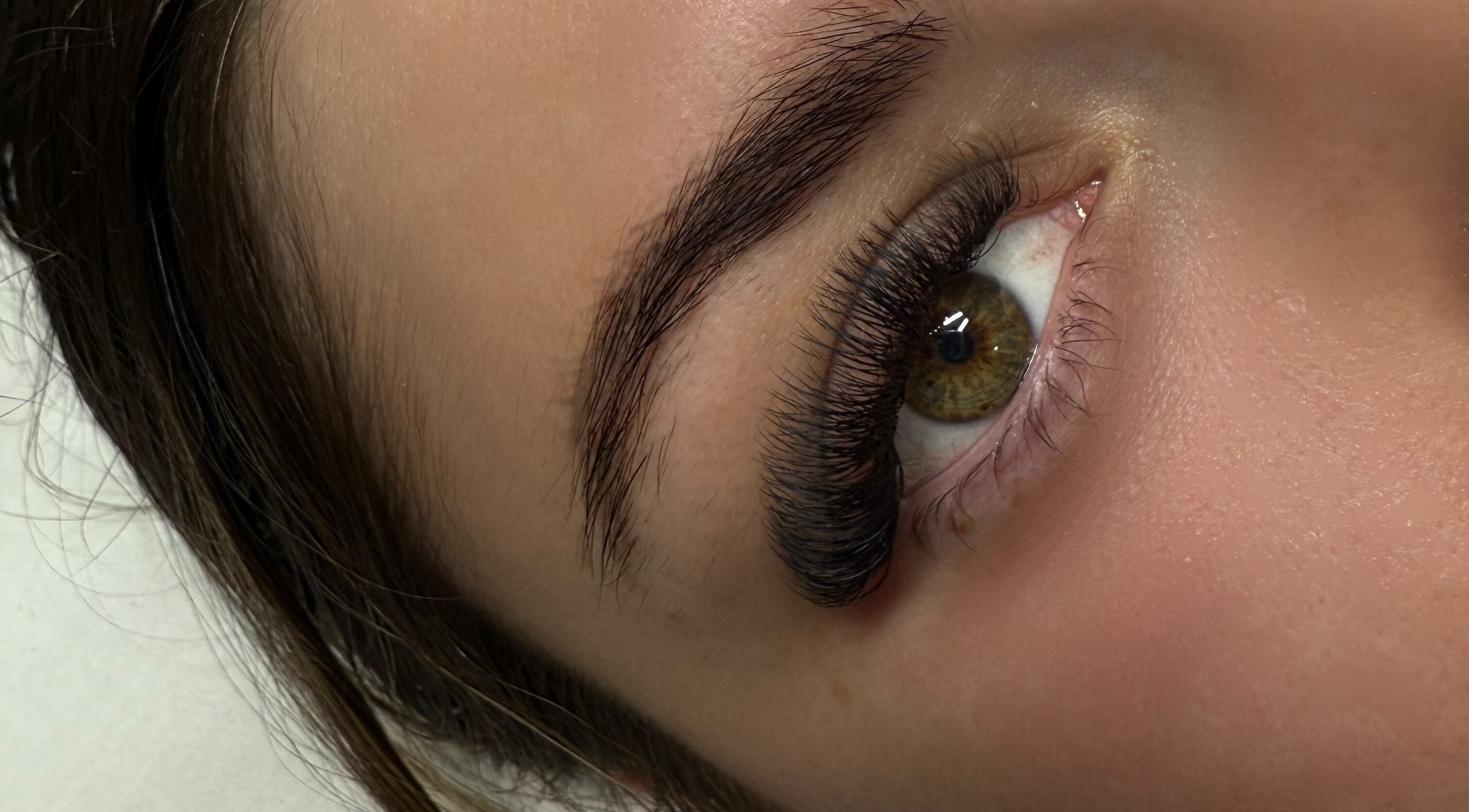 Close-up of eyelash extensions at Rayas.Beautybar, Beenleigh, Queensland, AU, showcasing volumized natural look.