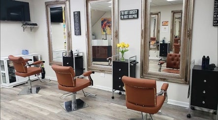 Chic salon with brown chairs and large mirrors at Millie's All About You, New York, New York, US.