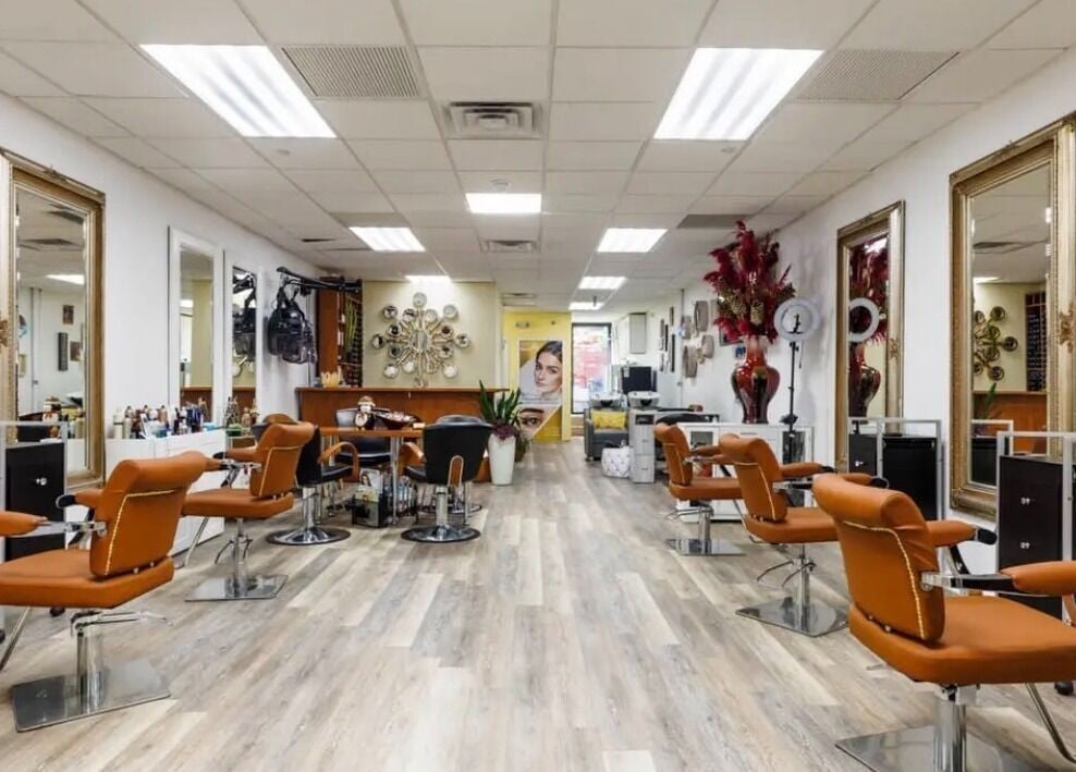 Inviting salon interior at Millie's All About You, New York, New York, US, featuring modern decor and styling chairs.