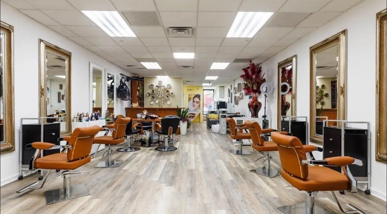 Inviting salon interior at Millie's All About You, New York, New York, US, featuring modern decor and styling chairs.