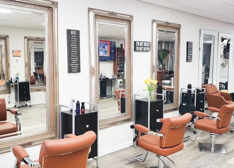 Elegant salon interior at Millie's All About You in New York, New York, US, featuring chic styling chairs and mirrors.