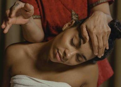 Woman enjoying a head massage at LV Massage & Spa in Fort Worth, Texas, US, showcasing relaxation and wellness.