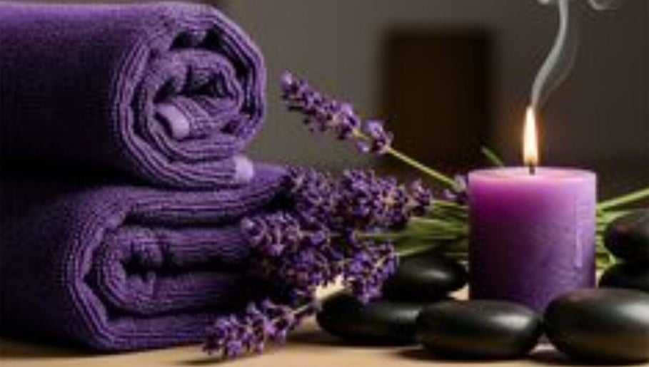 Relaxing spa setup at ILLY MOBILE MASSAGE THERAPY, Nairobi, Nairobi County, KE with lavender and candle.
