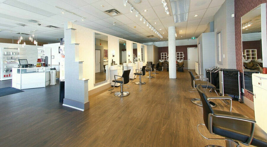 Spacious and modern salon interior at Venus Victoria Salon & Spa, Toronto, Ontario, CA, featuring stylish chairs.
