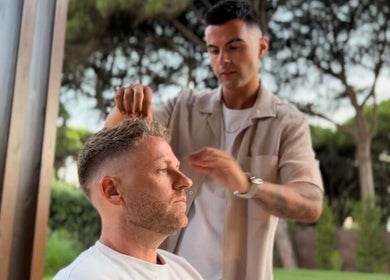 Hairstylist crafting a fresh look on a client outdoors at FICA Faded, Parede, Lisboa, PT.