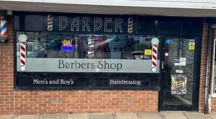 The Gentlemens Room Classic Barbers, located in Exmouth, England, offers stylish men's grooming in a classic barbershop setting.