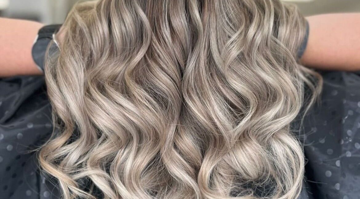 Blonde wavy hairstyle at Taylormadehair salon in Mountain Ash, Wales, GB. Experience stunning hair transformations.