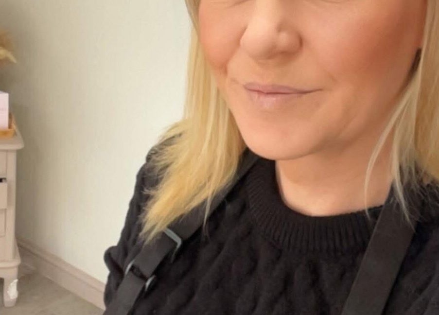 Professional stylist at Taylormadehair, Mountain Ash, Wales, GB with warm decor.