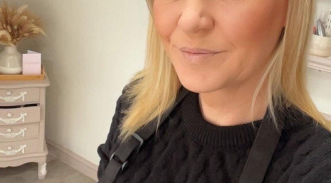 Professional stylist at Taylormadehair, Mountain Ash, Wales, GB with warm decor.