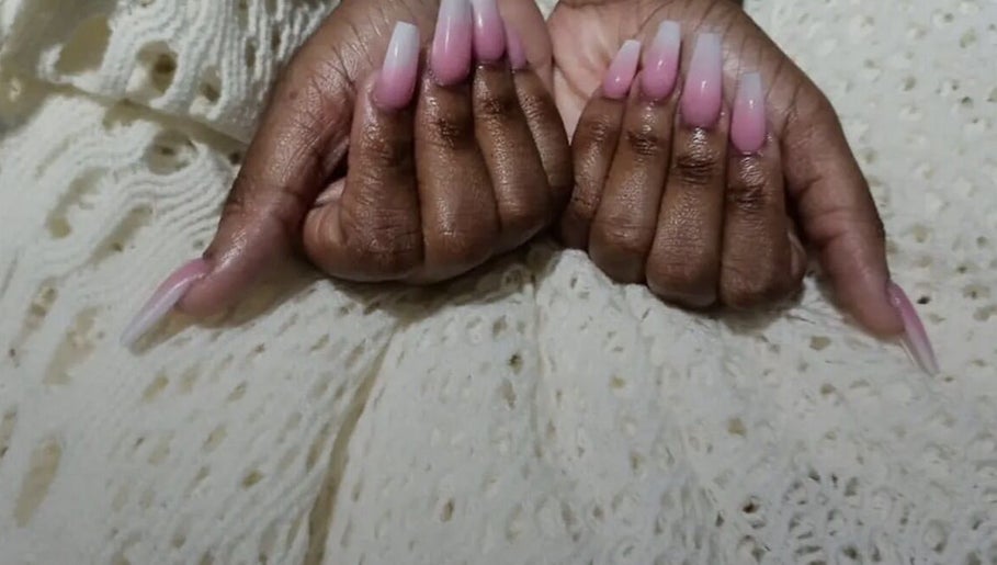 Elegant ombre pink nails by Nailzxnicey, Saint Thomas, Saint Thomas, BB, on a textured fabric.