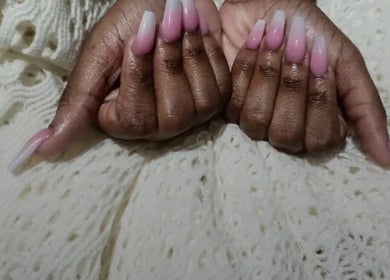 Elegant ombre pink nails by Nailzxnicey, Saint Thomas, Saint Thomas, BB, on a textured fabric.