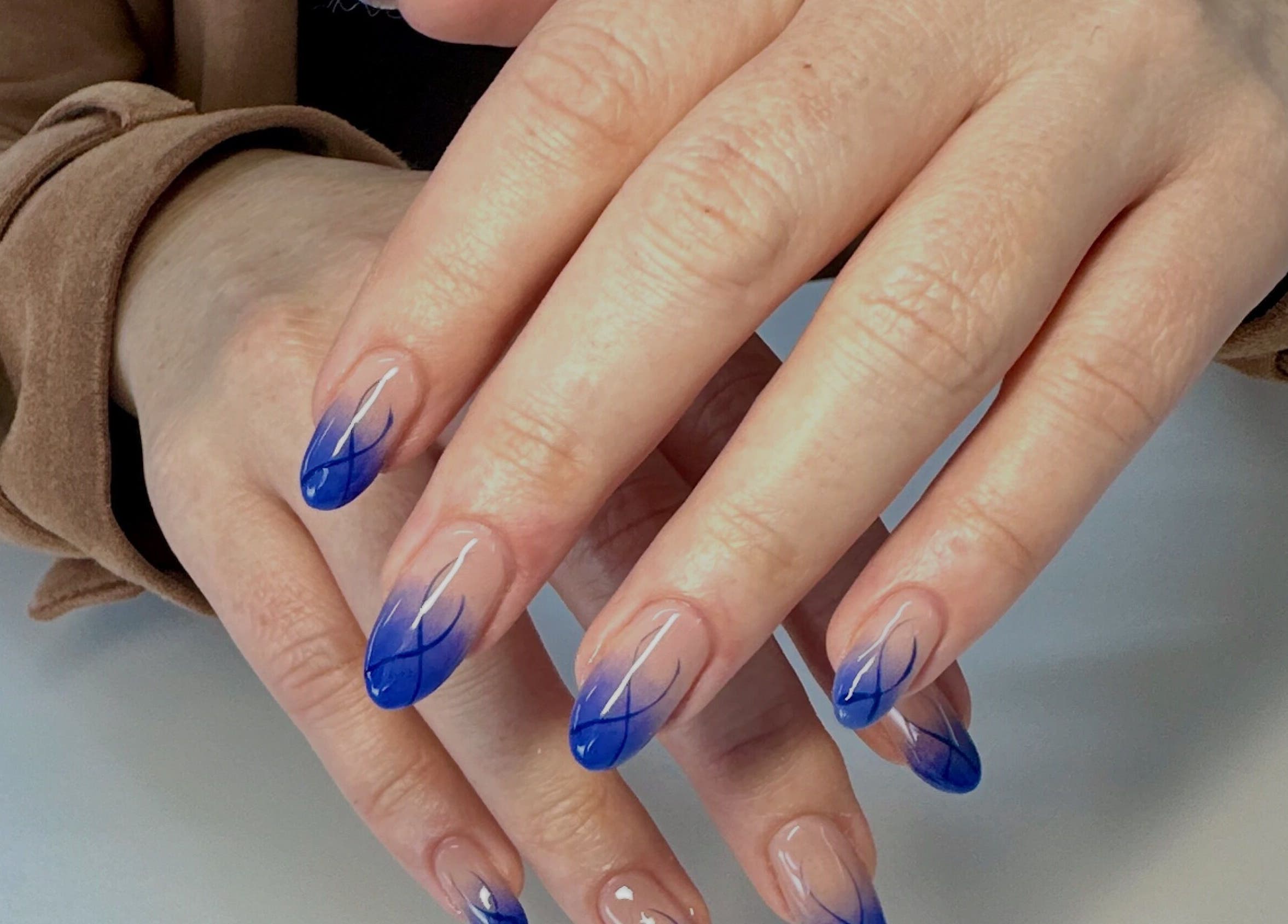 Elegant blue nail art at LuBella Beauty, Waterfall, Kwazulu-natal, ZA. Experience our exquisite manicures.