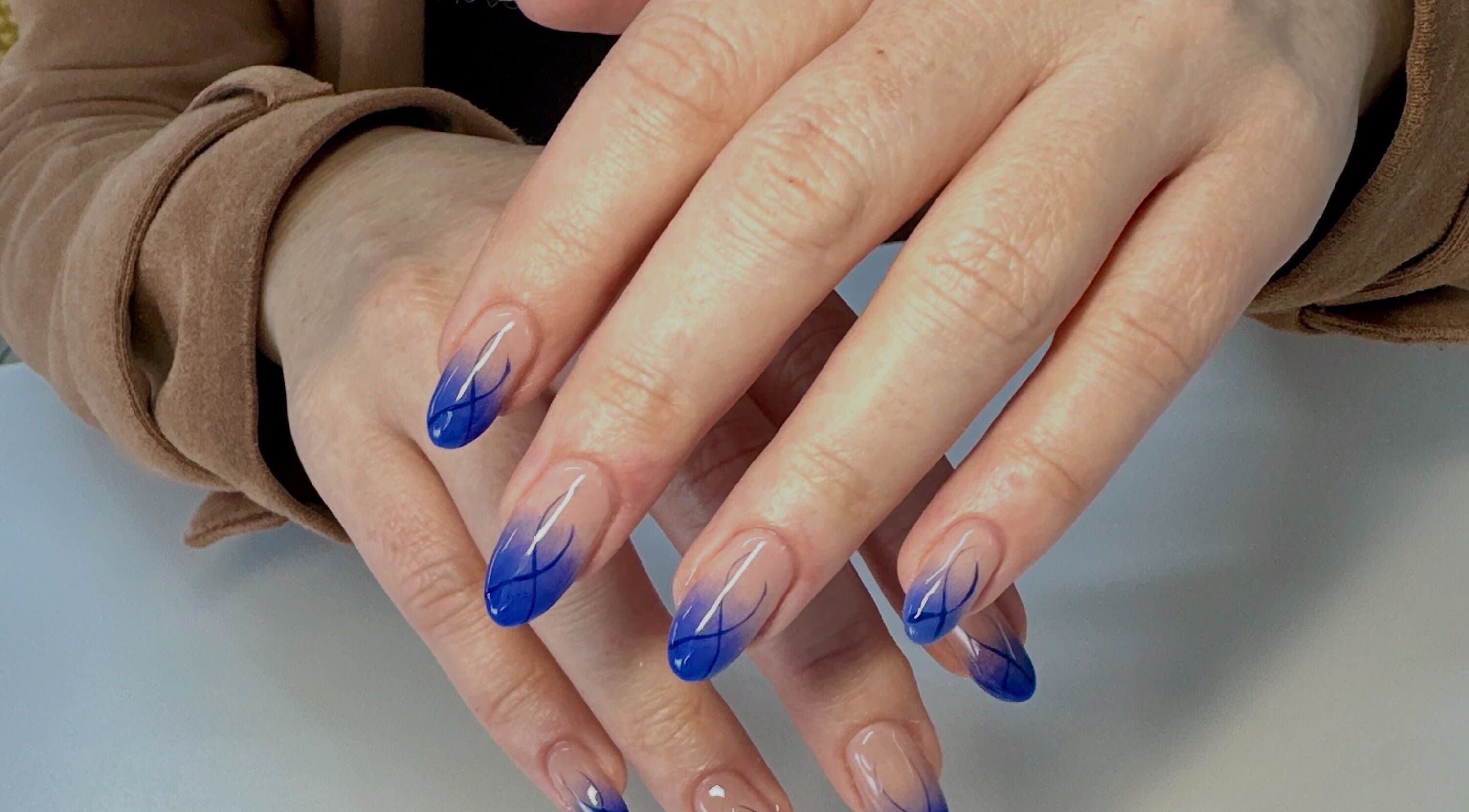 Elegant blue nail art at LuBella Beauty, Waterfall, Kwazulu-natal, ZA. Experience our exquisite manicures.