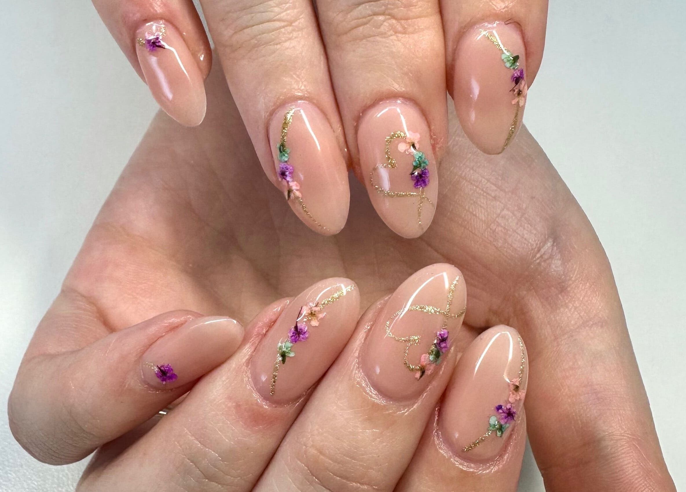 Intricate floral nail art at LuBella Beauty, Waterfall, Kwazulu-natal, ZA showcasing detailed craftsmanship.