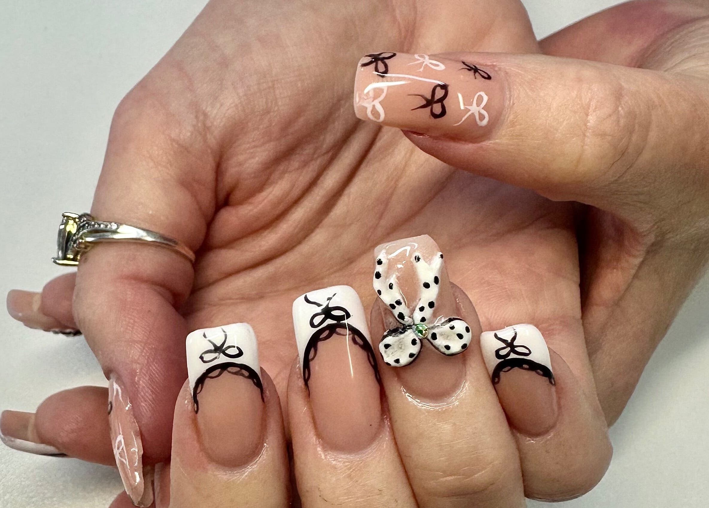 Detailed nail art with bows at LuBella Beauty, Waterfall, Kwazulu-natal, ZA.