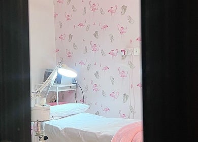 Flamingo Facial room with flamingo wallpaper in Sib, Muscat Governorate, OM.
