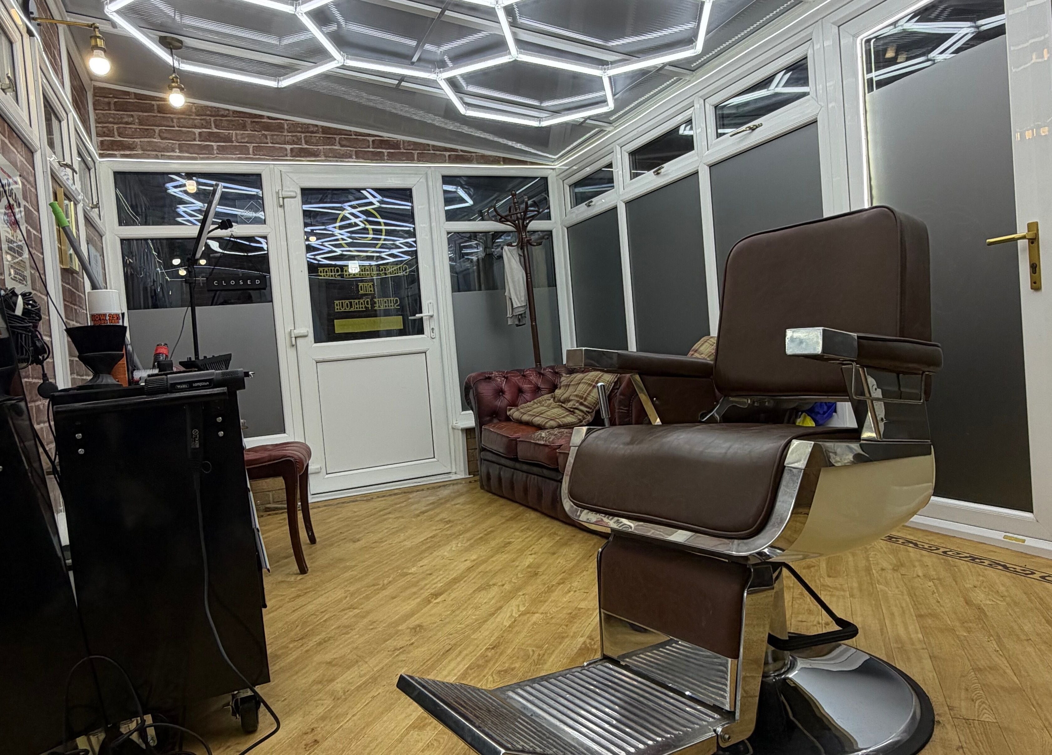 Sophisticated interior of No45 Bespoke Barbering in Emneth, England, GB featuring stylish barber chair and decor.