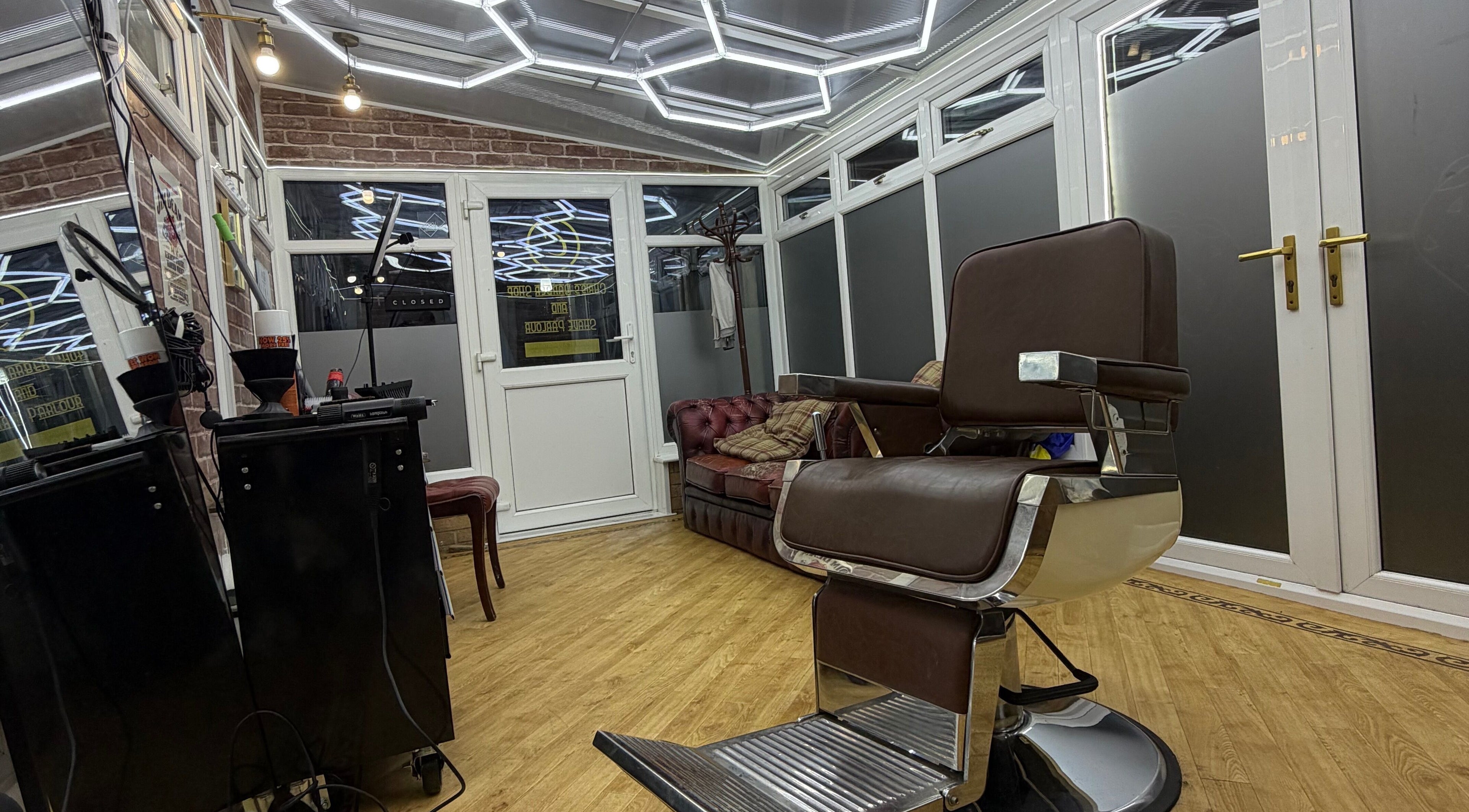 Sophisticated interior of No45 Bespoke Barbering in Emneth, England, GB featuring stylish barber chair and decor.