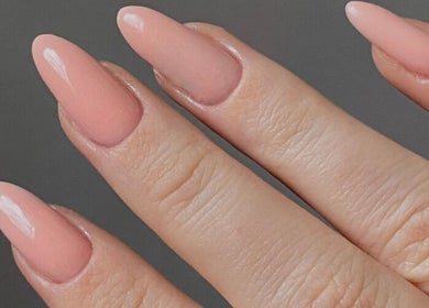 Close-up of elegant pink nails at The Nail Club By Ez, Newport, Wales, GB. Perfect manicure execution.