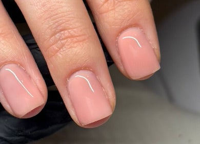 Elegant nude manicure at The Nail Club By Ez in Newport, Wales, GB showcasing glossy, well-groomed nails.