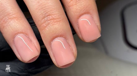 Elegant nude manicure at The Nail Club By Ez in Newport, Wales, GB showcasing glossy, well-groomed nails.