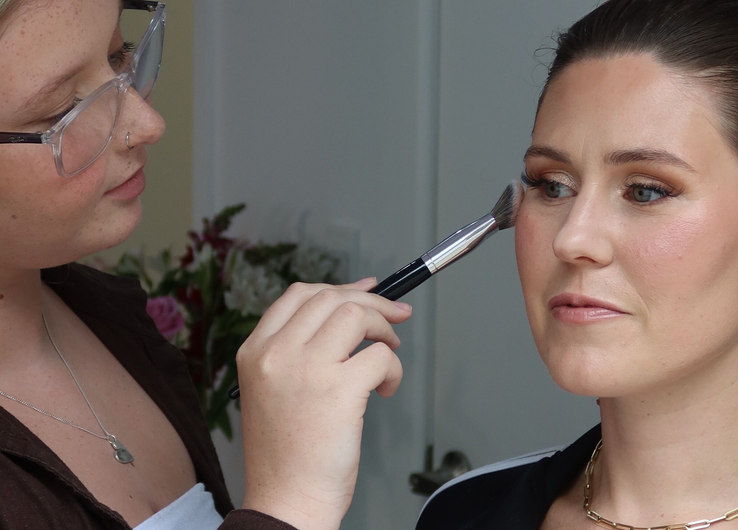 Makeup artist applying eyeshadow at Makeup By Jaimee, Ōhaupō, Waikato Region, NZ.