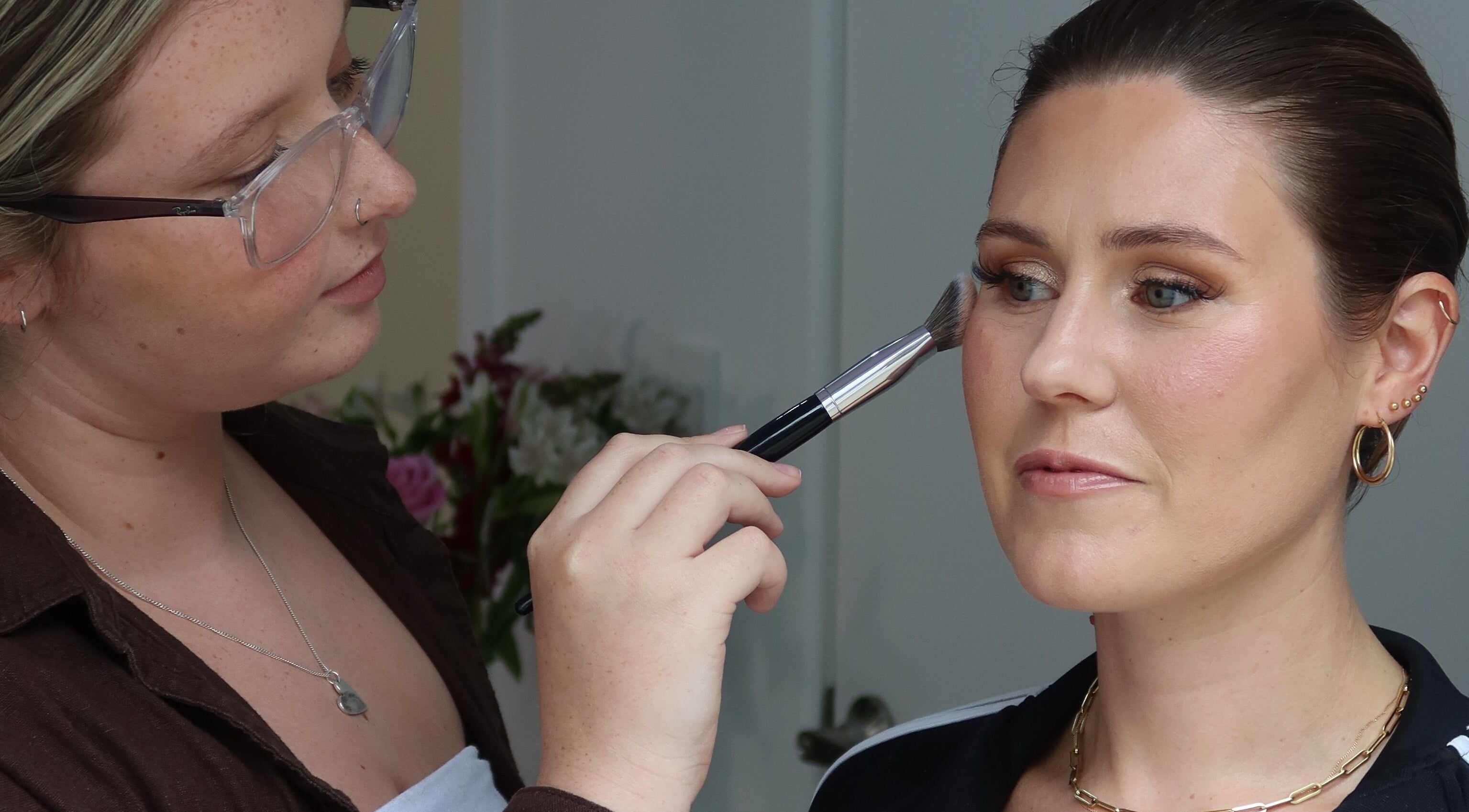 Makeup artist applying eyeshadow at Makeup By Jaimee, Ōhaupō, Waikato Region, NZ.
