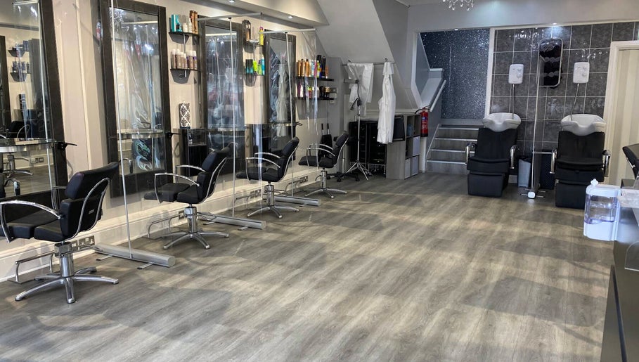 Modern interior of Spectrum Hair, Tanning & Beauty Salon in Welwyn Garden City, England, GB with stylish chairs.