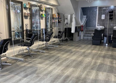 Modern interior of Spectrum Hair, Tanning & Beauty Salon in Welwyn Garden City, England, GB with stylish chairs.