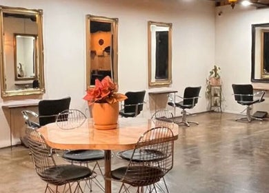 Elegant salon interior at Hair Maverick, Melbourne, Victoria, AU with chic chairs and mirrors.