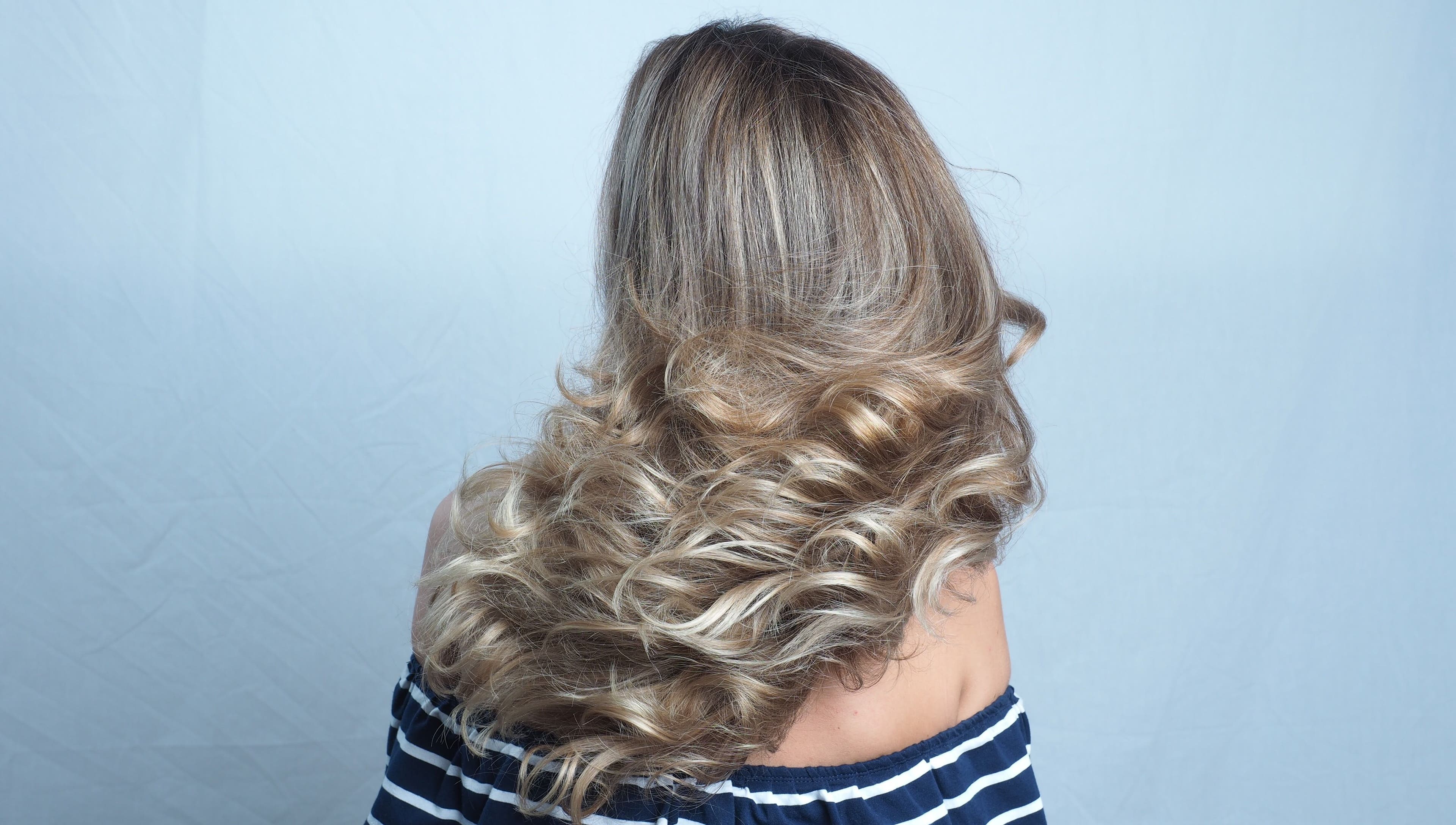 Voluminous wavy hairstyle at Hair Maverick salon in Melbourne, Victoria, AU.