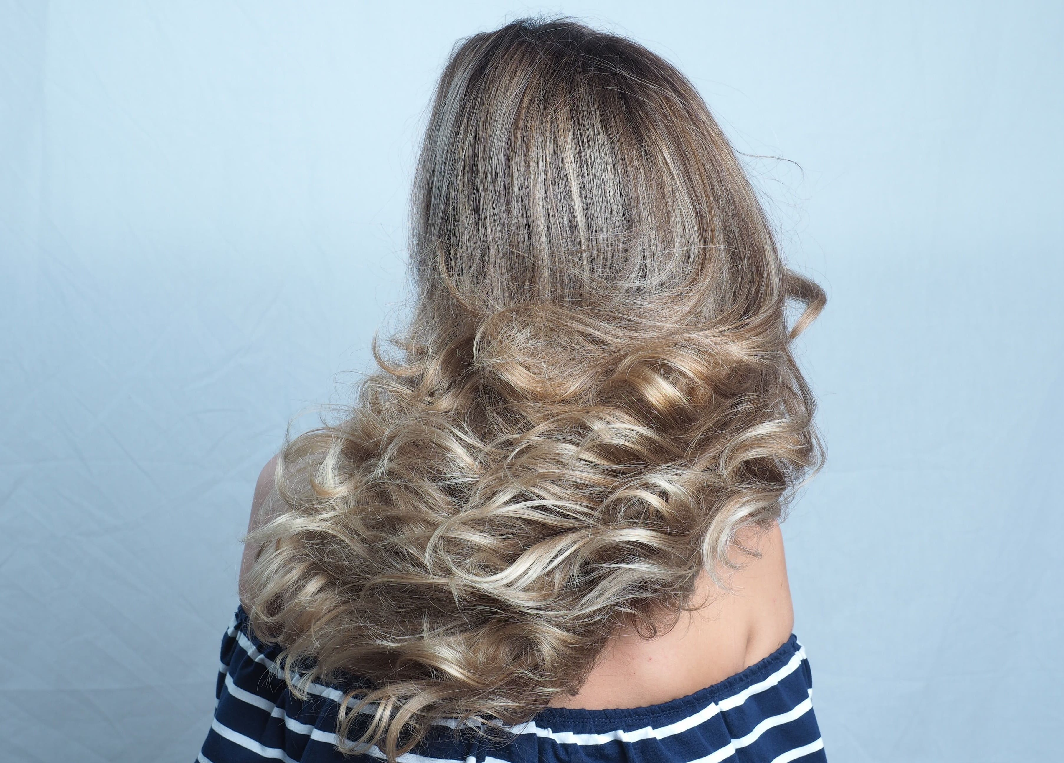 Voluminous wavy hairstyle at Hair Maverick salon in Melbourne, Victoria, AU.