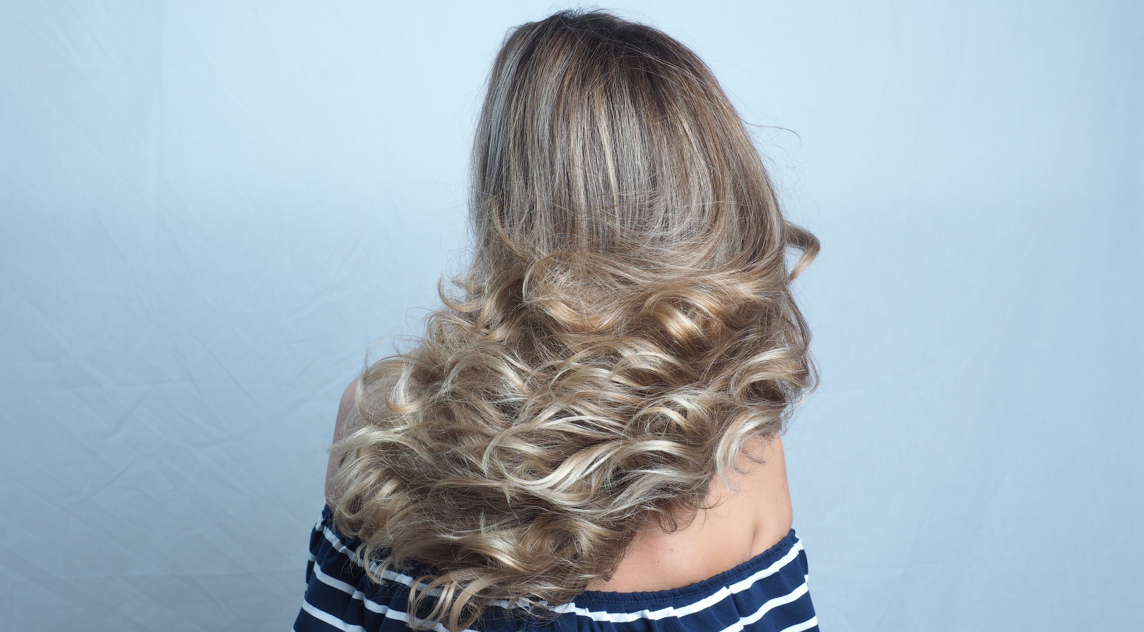 Voluminous wavy hairstyle at Hair Maverick salon in Melbourne, Victoria, AU.