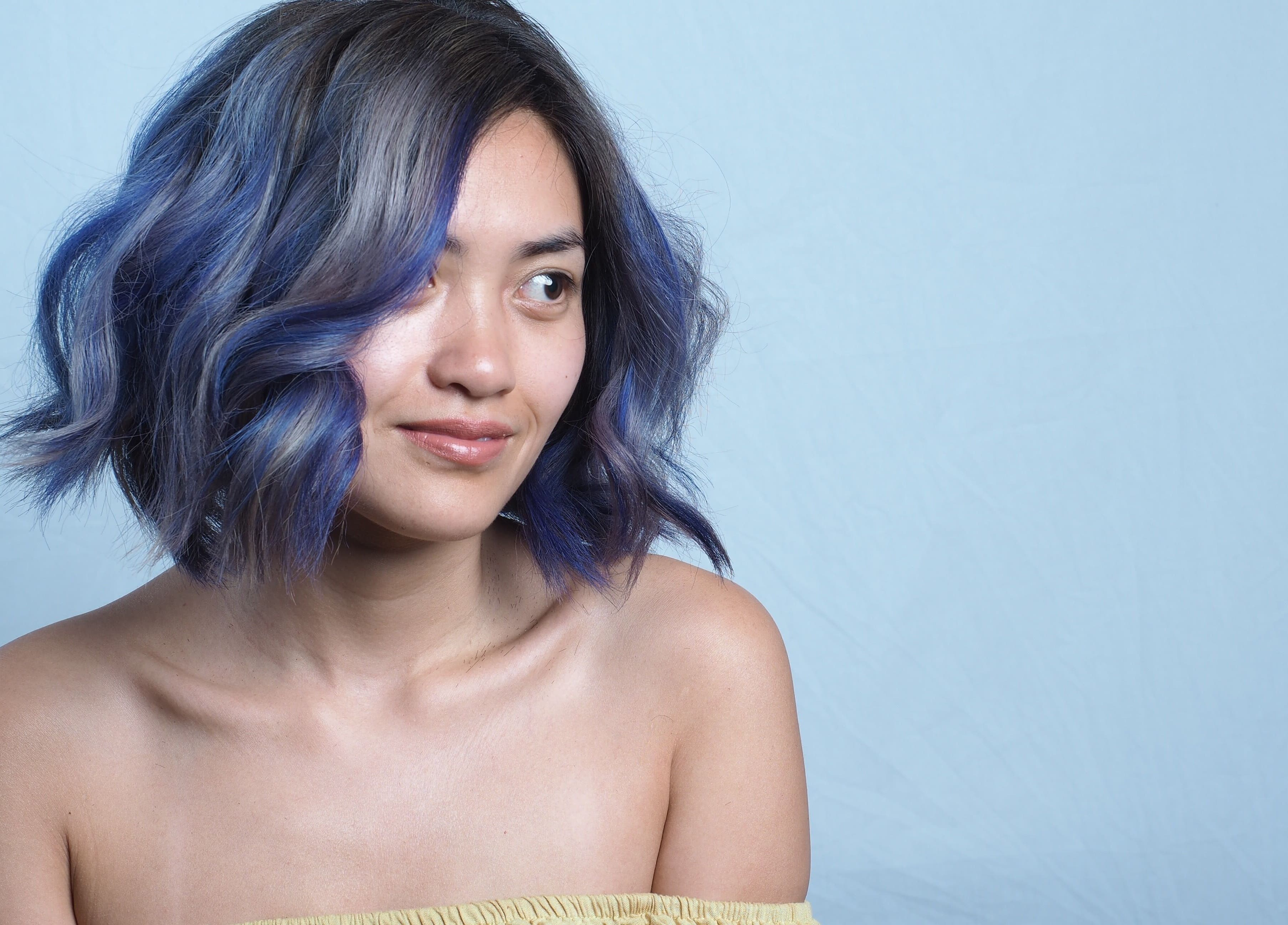 Woman with vibrant blue hair at Hair Maverick, Melbourne, Victoria, AU.