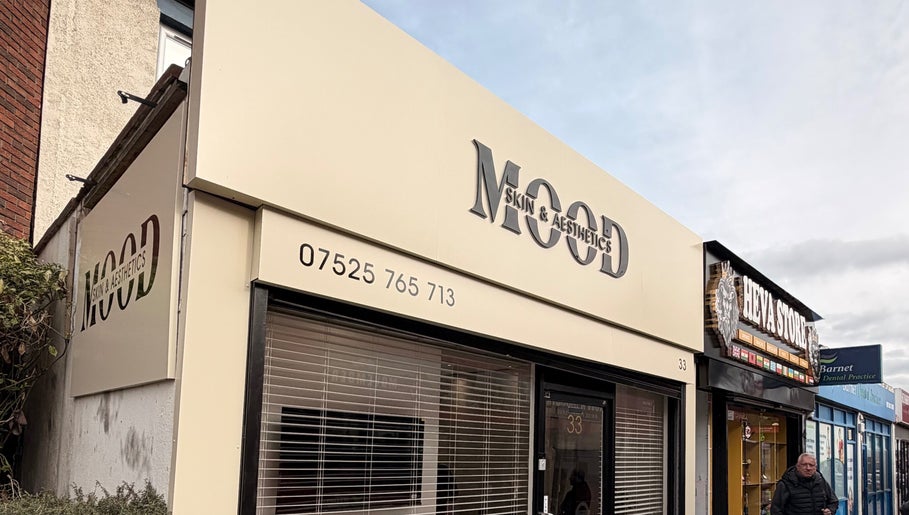 Exterior view of Deli White Massage MOOD in London, England, GB. Modern storefront with sleek signage.