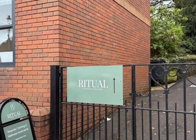 Entrance of Deli White Massage RITUAL in Berkhamsted, England, GB showcasing signage.