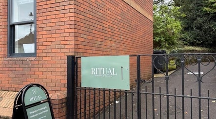 Entrance of Deli White Massage RITUAL in Berkhamsted, England, GB showcasing signage.