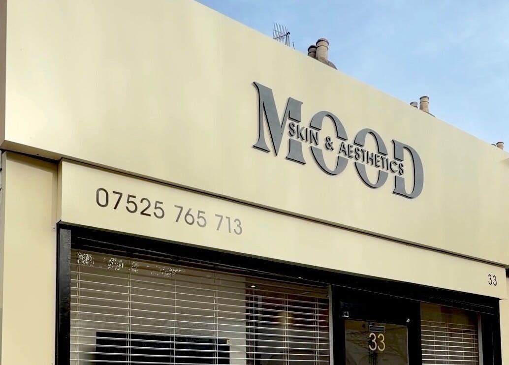 Exterior of MOOD SKIN & AESTHETICS in Barnet, England, GB, featuring elegant branding and contact details.