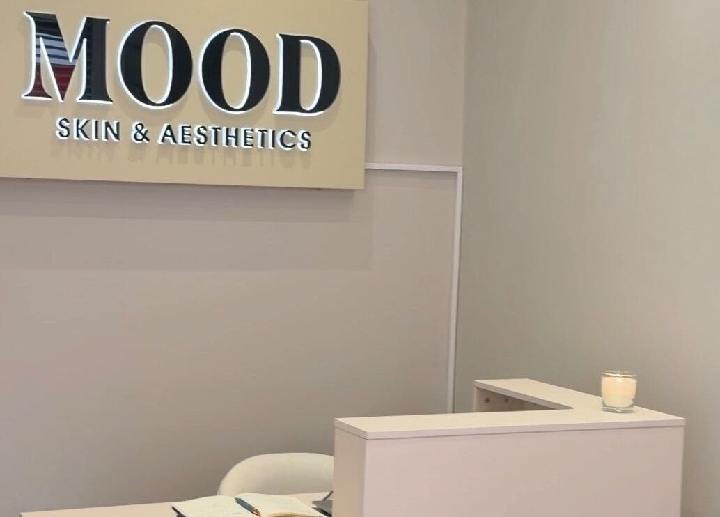 Reception area of MOOD SKIN & AESTHETICS in Barnet, England, GB featuring a candle and elegant decor.