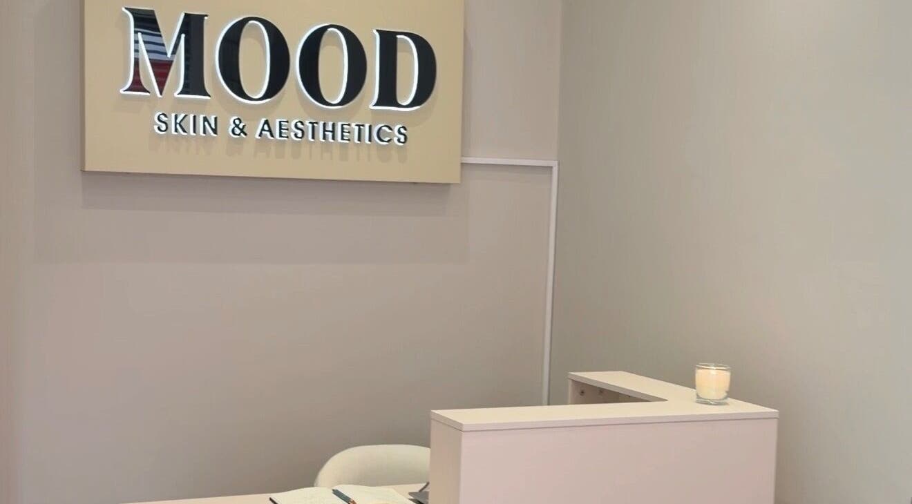 Reception area of MOOD SKIN & AESTHETICS in Barnet, England, GB featuring a candle and elegant decor.