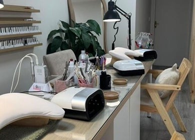 Modern nail station at Iz Does Nails, Todmorden, England, GB, showcasing manicure tools and stylish seating.