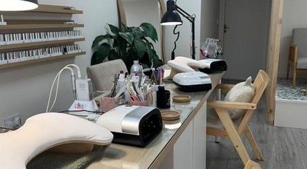 Modern nail station at Iz Does Nails, Todmorden, England, GB, showcasing manicure tools and stylish seating.