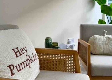 Cozy seating with pumpkin decor at Iz Does Nails, Todmorden, England, GB creates a welcoming ambiance.