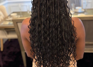 Intricate braided hairstyle at Braids by Tipp in Atlanta, Georgia, US showcasing elegant craftsmanship.