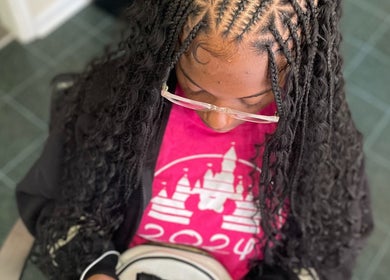 Intricate braids styled at Braids by Tipp, Atlanta, Georgia, US. Perfectly detailed hair artistry.